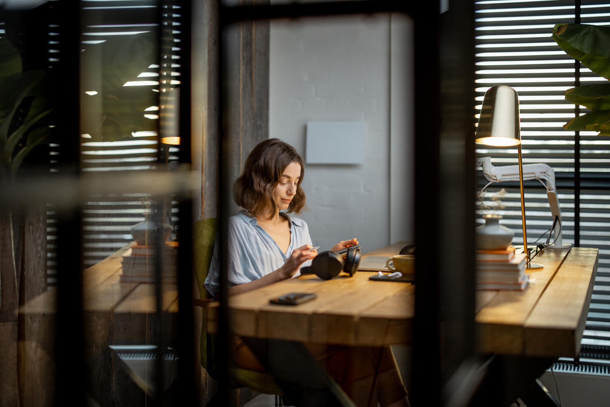 A person reviewing their finances on a laptop at home
